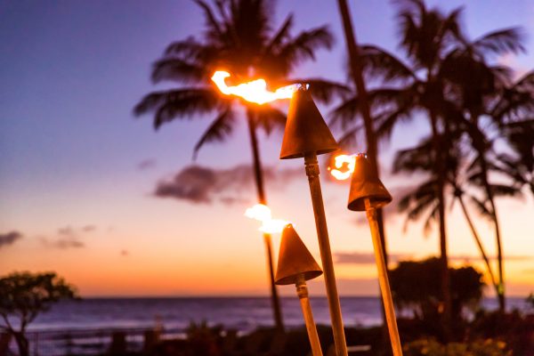 best things to do in Oahu; sunset and tiki torches in Hawaii luau